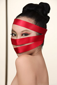 Photograph of Chinese photo model Amelia with gift ribbon wrapped arround her head